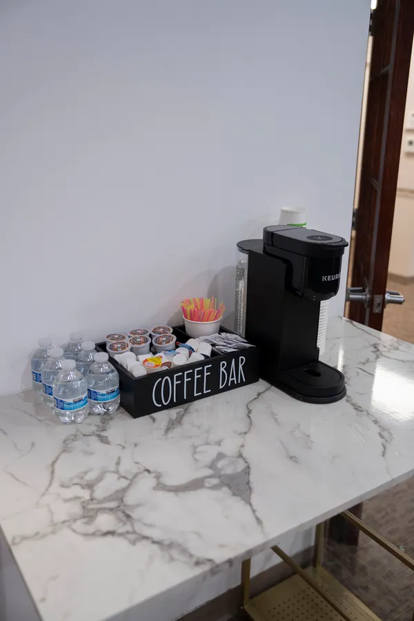 Coffee and bottled water station in the Revive Dental office
